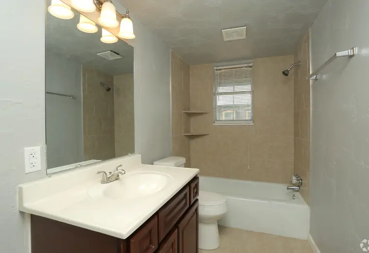 Bathroom with tiled tub surround